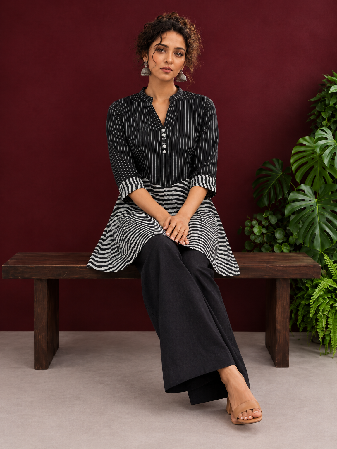 Classic Black & White Pinstripe Tunic with Contrast Striped Panel and Mandarin Collar — seated detail