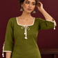 Timeless Olive Green Cotton Tunic with Tasseled Tie-Up Neckline and Contrast Lace Hem Border — styled view