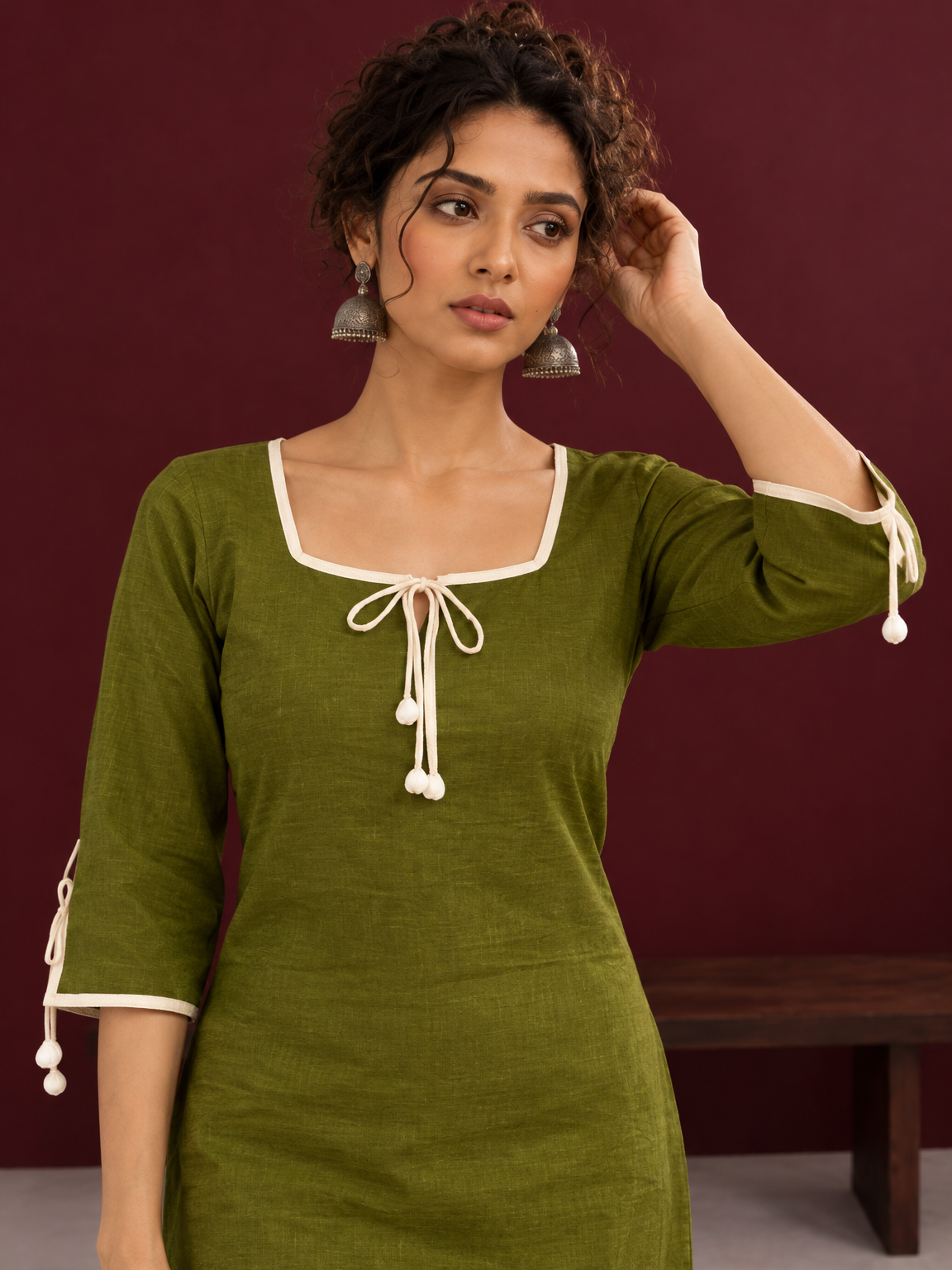 Timeless Olive Green Cotton Tunic with Tasseled Tie-Up Neckline and Contrast Lace Hem Border — styled view