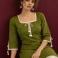 Timeless Olive Green Cotton Tunic with Tasseled Tie-Up Neckline and Contrast Lace Hem Border — seated detail