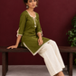 Timeless Olive Green Cotton Tunic with Tasseled Tie-Up Neckline and Contrast Lace Hem Border — seated