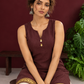 Elegant Brown Cotton Silk Sleeveless Kurta with Gold Zari Border and Notched Neckline — seated detail