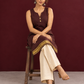 Elegant Brown Cotton Silk Sleeveless Kurta with Gold Zari Border and Notched Neckline — seated