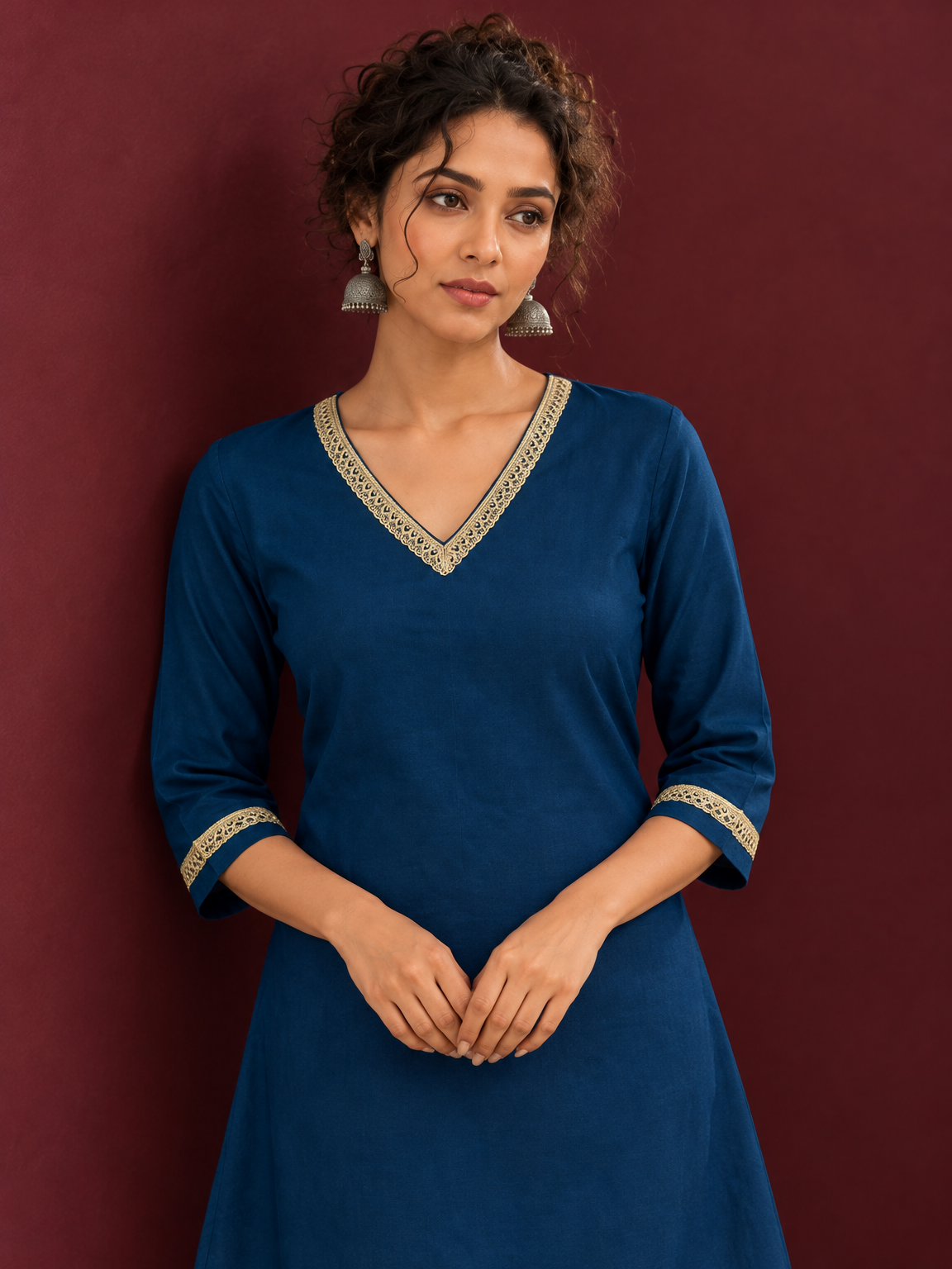 Elegant Teal Blue Cotton Tunic with Embellished Gold Lace V-Neckline and Matching Sleeve Cuffs — fabric detail