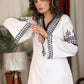 Straight ebony and ivory appliqued bell sleeve embroidered dress highlighted with velvet lace