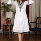 Straight ebony and ivory appliqued bell sleeve embroidered dress highlighted with velvet lace