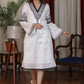 Straight ebony and ivory appliqued bell sleeve embroidered dress highlighted with velvet lace