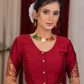 Elegant maroon cotton silk blouse highlighted with banarasi cutout on sleeves