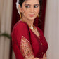 Elegant maroon cotton silk blouse highlighted with banarasi cutout on sleeves