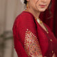 Elegant maroon cotton silk blouse highlighted with banarasi cutout on sleeves