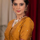 Exclusive metallic gold blouse with overall mirror embroidery highlighted with banarasi lace