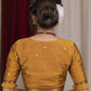 Exclusive metallic gold blouse with overall mirror embroidery highlighted with banarasi lace