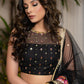 Classic Black Cotton Silk Lehenga paired with delicately embellished net dupatta accentuated with heavy floral embroidery and hand embellishments