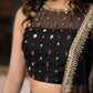 Classic Black Cotton Silk Lehenga paired with delicately embellished net dupatta accentuated with heavy floral embroidery and hand embellishments