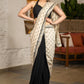 Elegant Light Beige Cotton Silk Saree With Black Georgette Combination Highlighted With Beautiful Floral Embroidery And Contrast Lace
