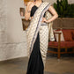 Elegant Light Beige Cotton Silk Saree With Black Georgette Combination Highlighted With Beautiful Floral Embroidery And Contrast Lace