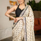 Elegant Light Beige Cotton Silk Saree With Black Georgette Combination Highlighted With Beautiful Floral Embroidery And Contrast Lace