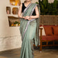 Elegant Sage Green Chanderi Saree Highlighted With Contrast Floral Lace