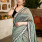 Elegant Sage Green Chanderi Saree Highlighted With Contrast Floral Lace