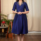 Blue cotton silk dress with exclusively embellished collar