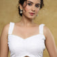 Elegant white Chikankari strappy blouse with Moti detailing.