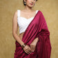Elegant white Chikankari strappy blouse with Moti detailing.