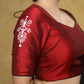 Graceful maroon cotton silk blouse with white hand painted motif on the sleeves & the back