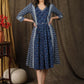 Beautiful indigo gathered dress with coin embellishments