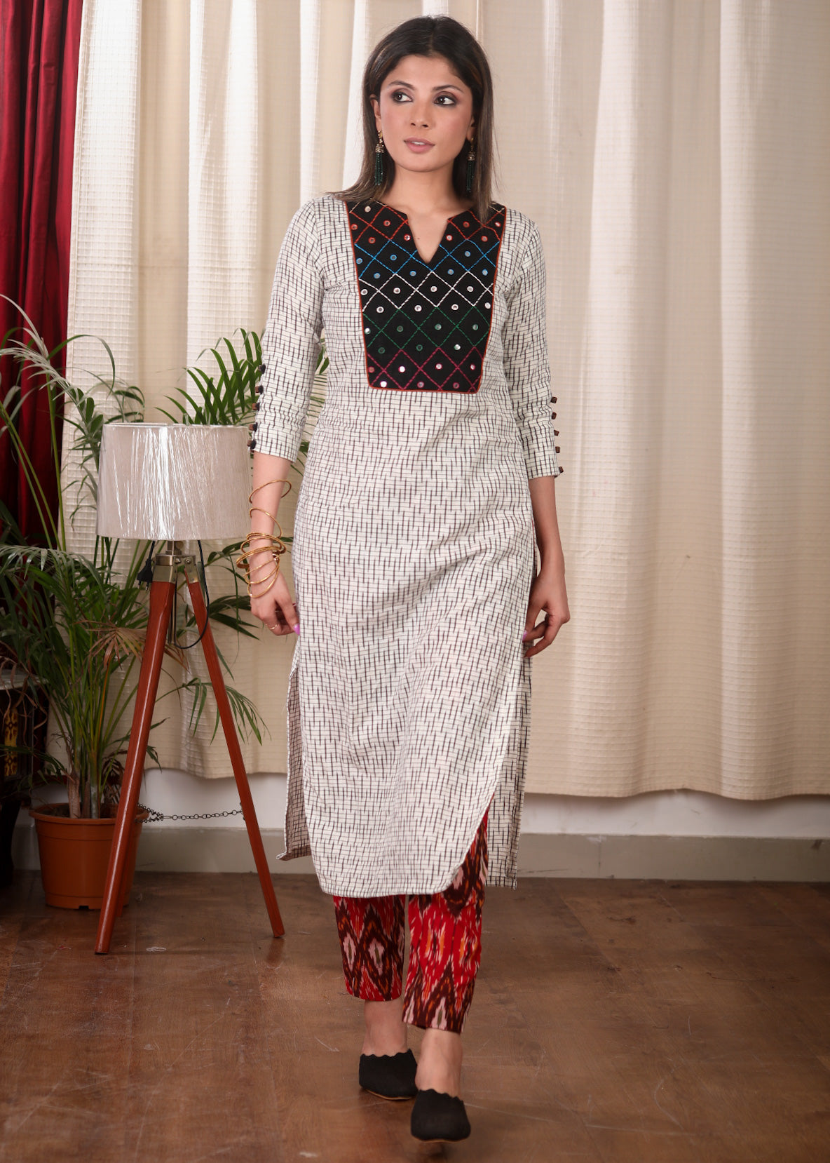 Graceful Straight Cut Ikat Kurta with Hand Embroidered Mirror Work On the Yoke and Beaded Sleeves
