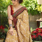 Exclusive mustard printed Cotton saree Accentuated with Ajrakh and Mirror border
