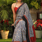 Spring bloom blue printed saree with Ajrakh and Cotton silk combination border with red stone Embellishment