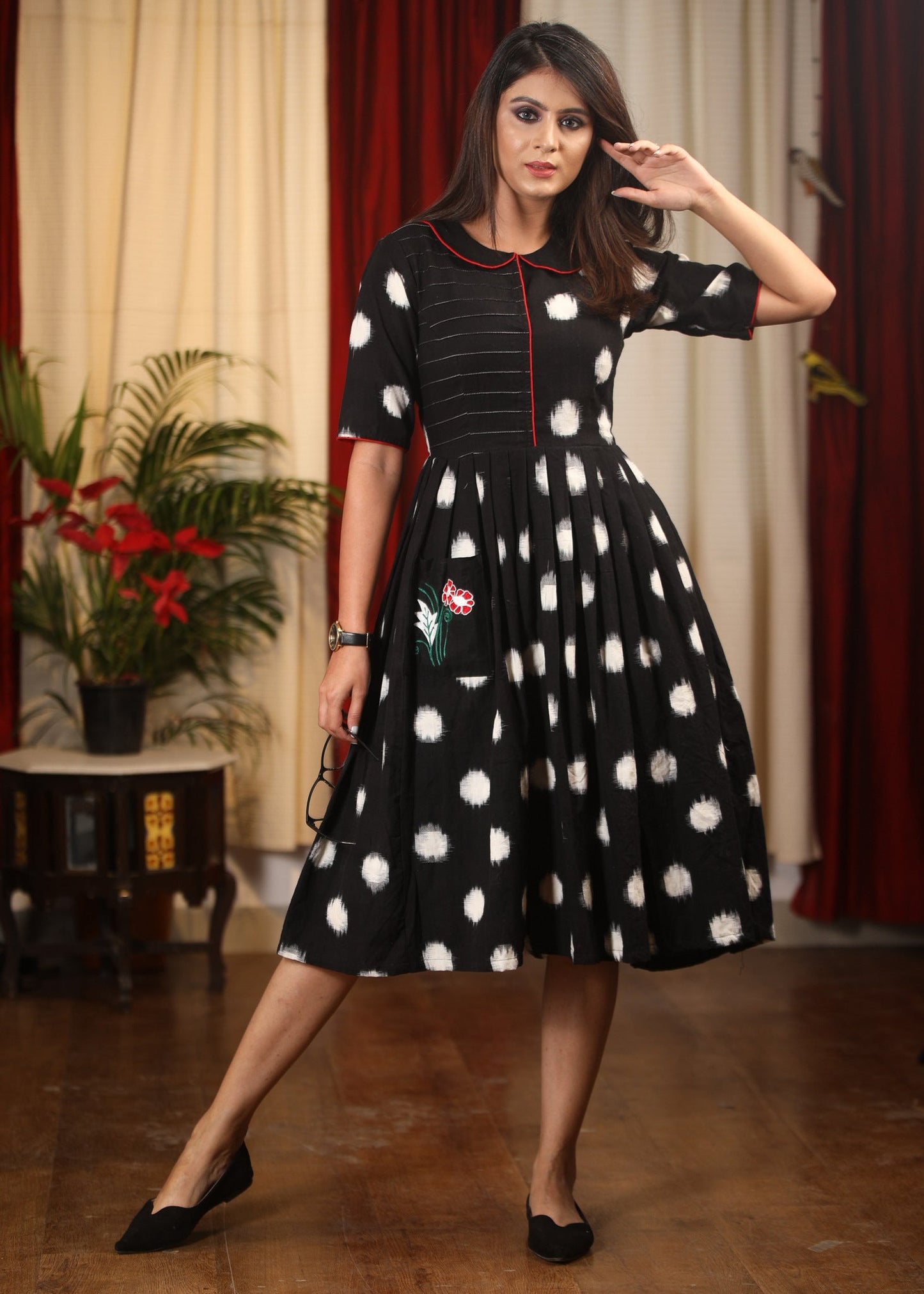 Authentic double ikat polka dotted dress with embroidered motif on pocket