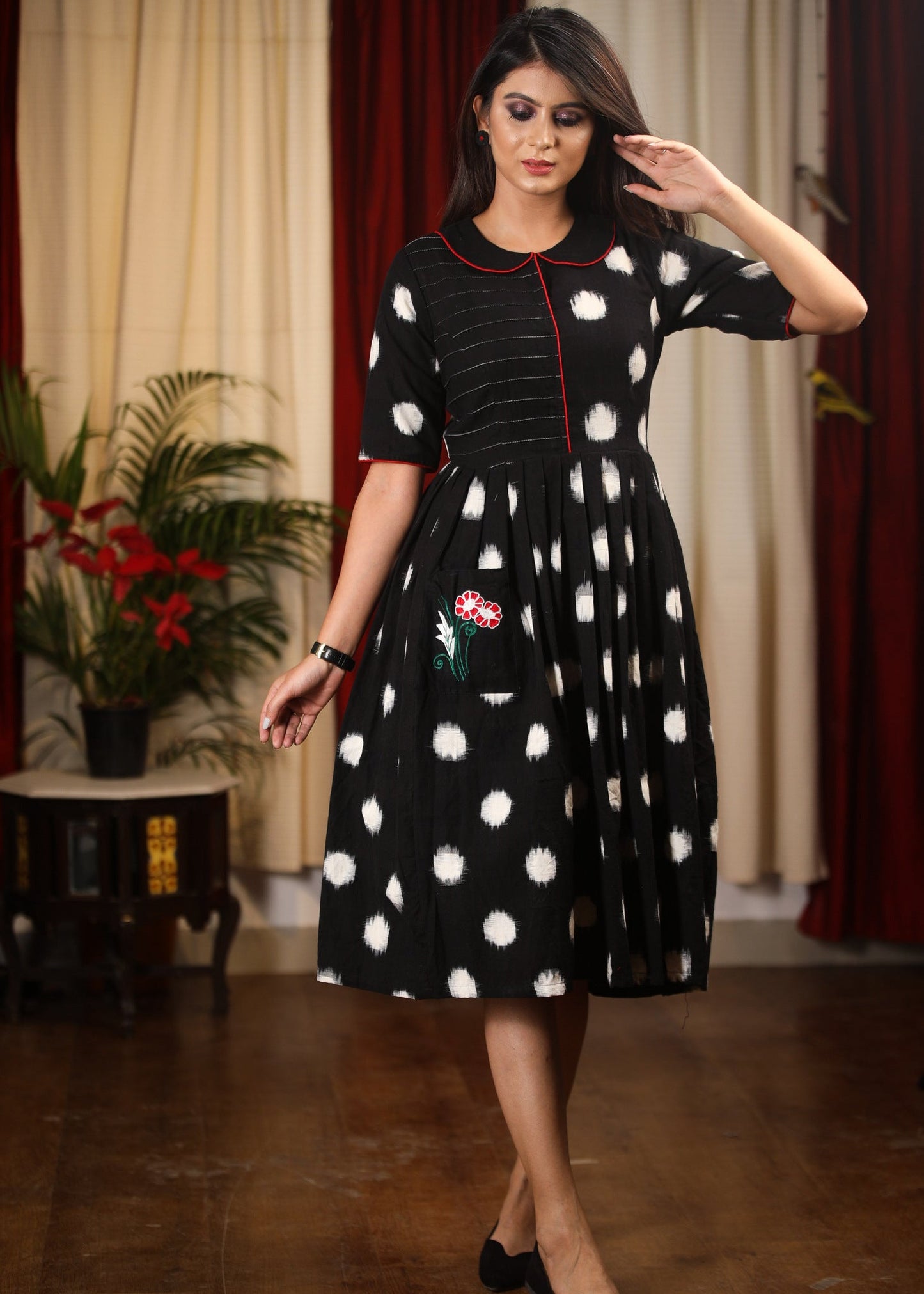 Authentic double ikat polka dotted dress with embroidered motif on pocket