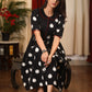 Authentic double ikat polka dotted dress with embroidered motif on pocket