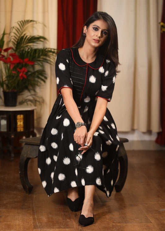 Authentic double ikat polka dotted dress with embroidered motif on pocket