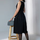 Black sleeveless rayon dress with off white lace detailing on neck and pockets